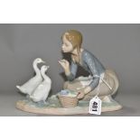 A LLADRO FIGURE GROUP FOOD FOR DUCKS, NO.4849, sculpted by Antonio Ruiz, issued 1973- 1995, height