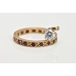 A 9CT GOLD FULL ETERNITY RING AND A PENDANT, the ring set with circular cut garnets (two are