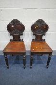 A PAIR OF GEORGE IV MAHOGANY HALL CHAIRS, in the manner of Gillows, with acanthus and shield back,