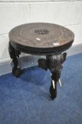 A 20TH CENTURY HARDWOOD INDIAN ELEPHANT OCCASIONAL TABLE, on triple legs, diameter 48cm x height