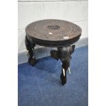 A 20TH CENTURY HARDWOOD INDIAN ELEPHANT OCCASIONAL TABLE, on triple legs, diameter 48cm x height