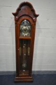 A MAHOGANY EFFECT LONGCASE CLOCK, with brassed arched dial, with two faux weights and pendulum,