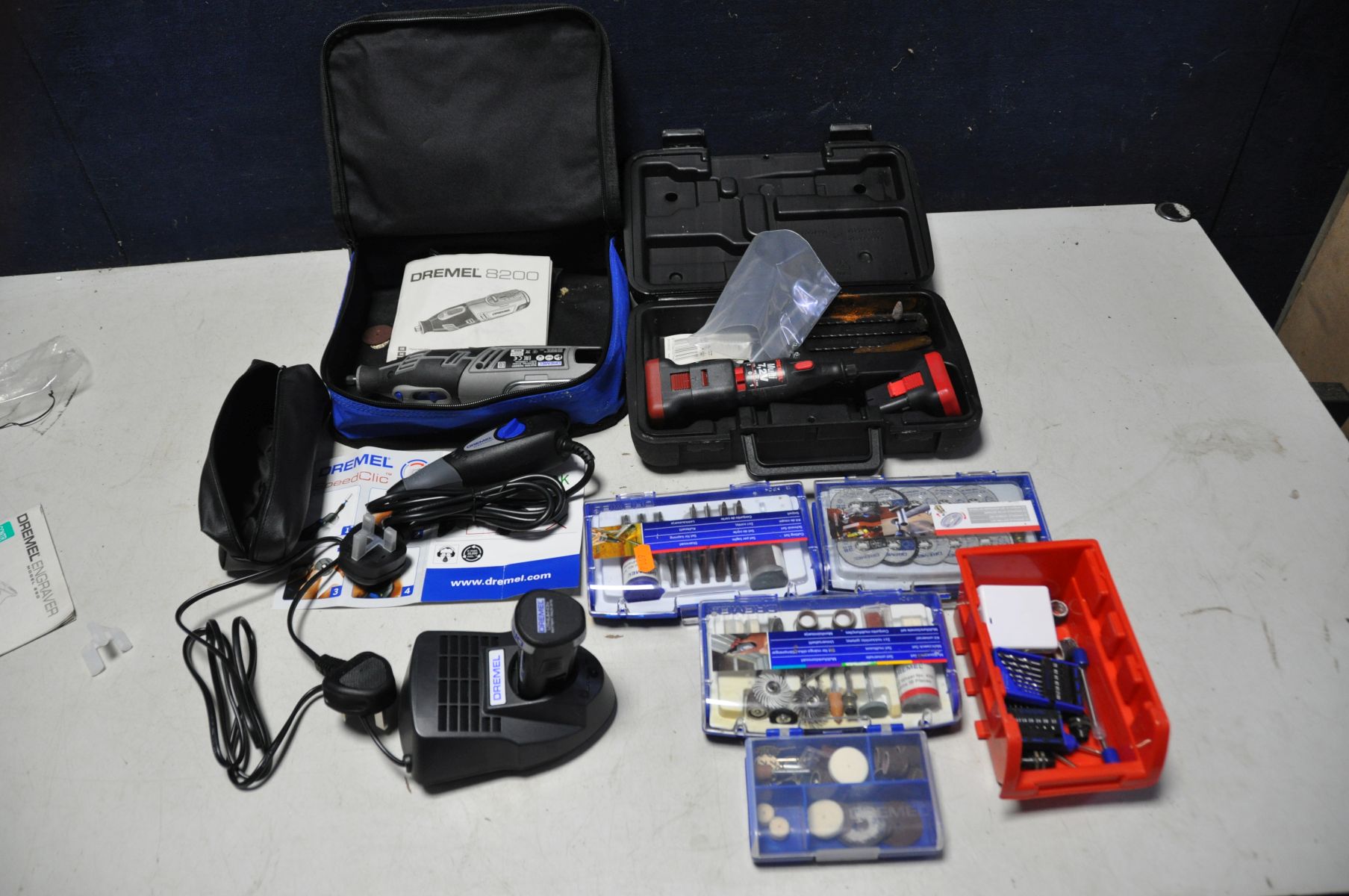 A DREMEL 8200 10.8V LITHIUM ION MULTITOOL SET with charger and battery along with a Dremel 290-95