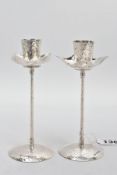 A PAIR OF HAMMER EFFECT CANDLE STICKS, hallmarked 'PG' Birmingham 2005, approximate gross weight