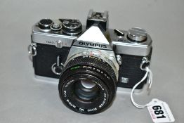 AN OLYMPUS OM-2N 35MM SLR CAMERA, fitted with an Olympus f1.8 50mm lens (Condition report: appears