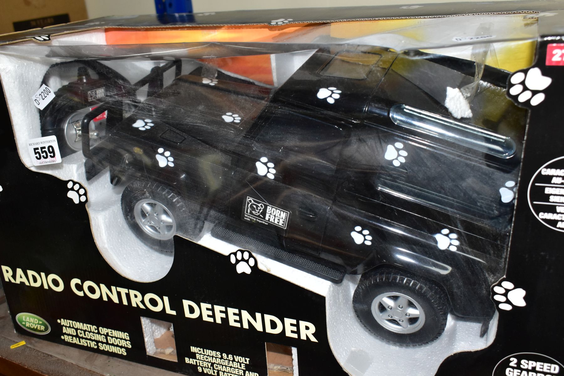 A BOXED RADIO CONTROLLED LAND ROVER DEFENDER, black Born Free edition, in original packaging with - Image 4 of 4