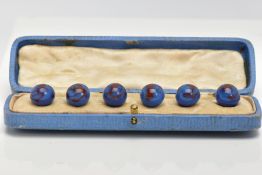 A CASED SET OF GLASS DRESS STUDS, comprising of six blue with red swirl glass ball studs, each