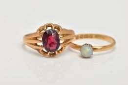 TWO 18CT GOLD RINGS, the first designed with a ten claw set, oval cut garnet (damaged), scallop