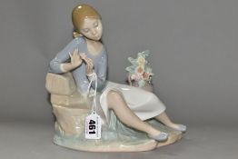 A LLADRO FIGURINE ROSALINDA, NO 4836, modelled as a young woman plucking off a rose petal,