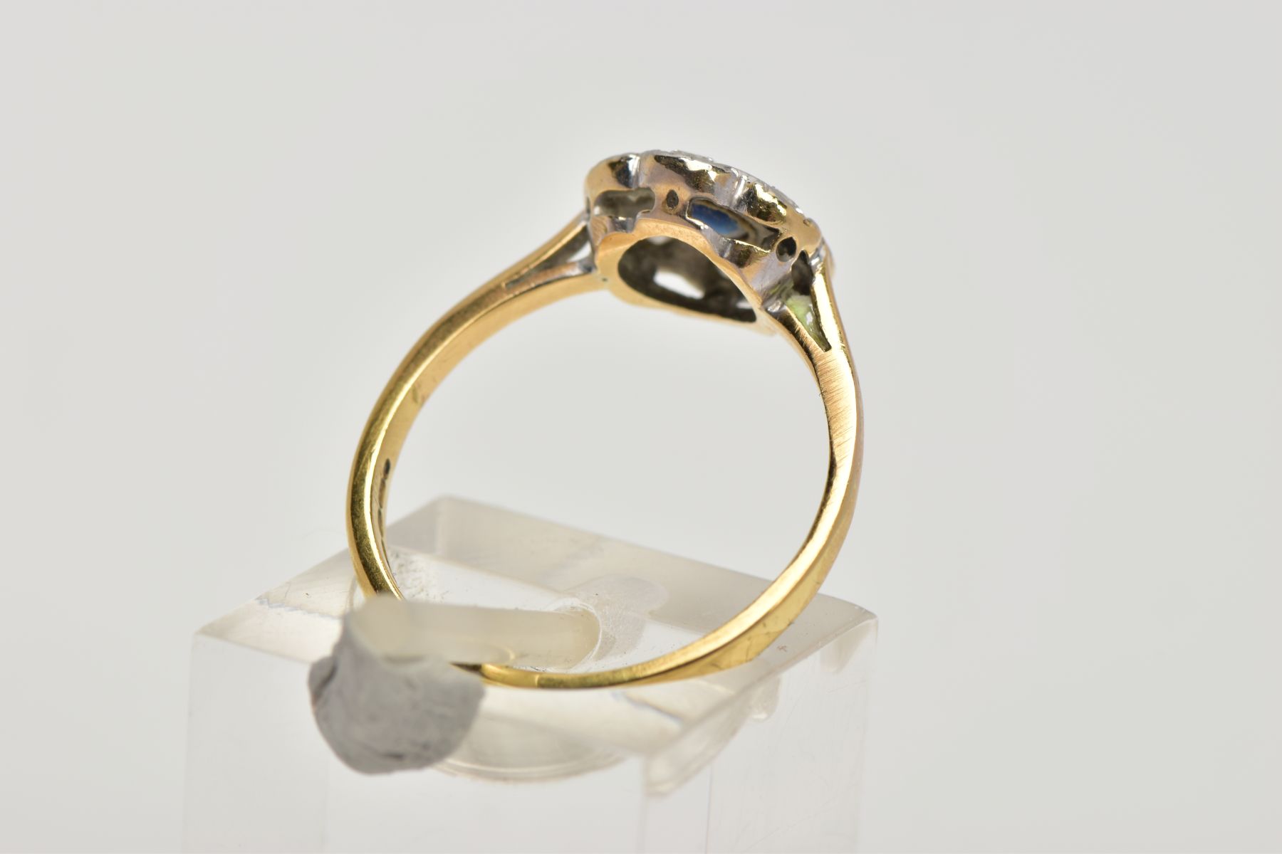 AN 18CT GOLD SAPPHIRE AND DIAMOND CLUSTER RING, of a flower shape, centring on a circular cut blue - Image 3 of 4