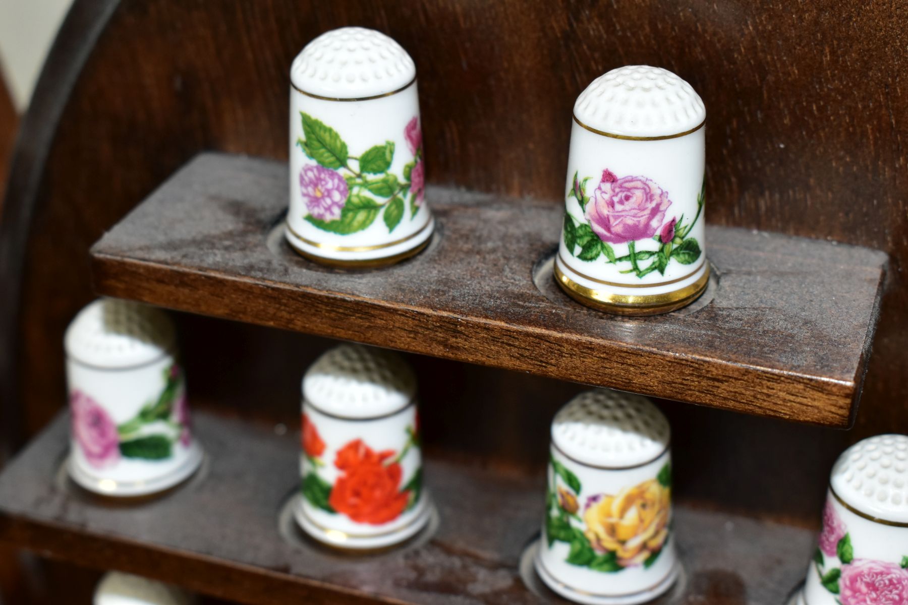 TWO WALL HANGING THIMBLE DISPLAY SHELVES CONTAINING MODERN PORCELAIN THIMBLES, comprising a set of - Image 7 of 15