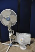 A COLLECTION OF ELECTRICAL EQUIPMENT to include two standing fans and a clip on fan along with a