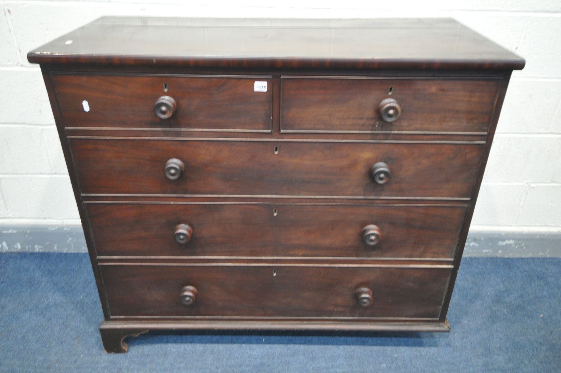 A GEORGIAN MAHOGANY CHEST OF TWO SHORT OVER THREE LONG DRAWERS, with circular handles, on bracket