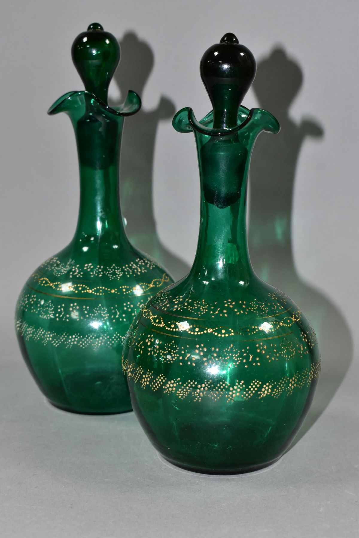 A PAIR OF VICTORIAN GREEN GLASS DECANTERS, with stoppers and four bands of dotted floral and other - Image 3 of 10