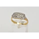 A YELLOW METAL DIAMOND RING, designed with a row of old cut diamonds (one round brilliant cut