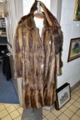 TWO FUR COATS WITH A FUR STOLE comprising two musquash fur coats approximate size 10/12, one with