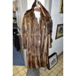 TWO FUR COATS WITH A FUR STOLE comprising two musquash fur coats approximate size 10/12, one with