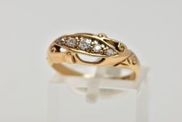 AN 18CT GOLD DIAMOND RING, designed with five old cut diamonds, within an openwork scroll detailed