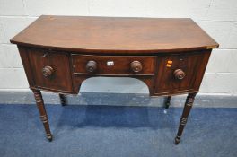 A GEORGIAN MAHOGANY BOWFRONT SIDEBOARD, with two deep frieze drawers flanking a central drawer, on