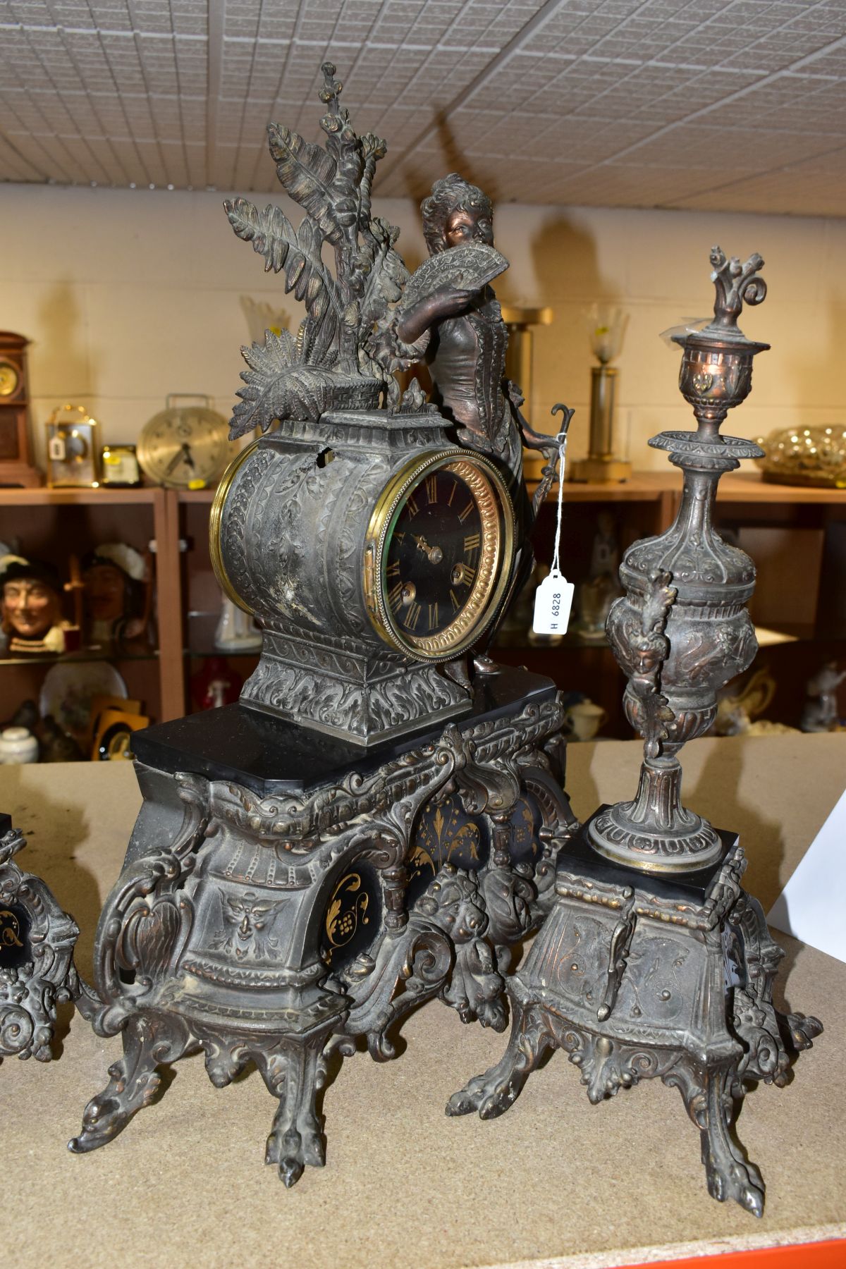 A LATE 19TH CENTURY BRONZED SPELTER AND BLACK SLATE CLOCK GARNITURE, the mantel clock with figure of - Image 13 of 14