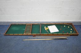 A 19TH CENTURY WALNUT FOLDING BAR BILLIARDS TABLE, retailed by A W Gamage ltd of Holborn, overall