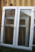 TWO UPVC DOUBLE GLAZED WINDOWS AND A SET OF FRENCH DOORS, actual frame width 66cm x height 148cm,