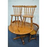 A PINE PEDESTAL DINING TABLE, diameter 106cm x height 76cm and four chairs (5)