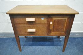 AN ARTS AND CRAFTS OAK SIDE CABINET, with two drawers and single cupboard door, width 89cm x depth