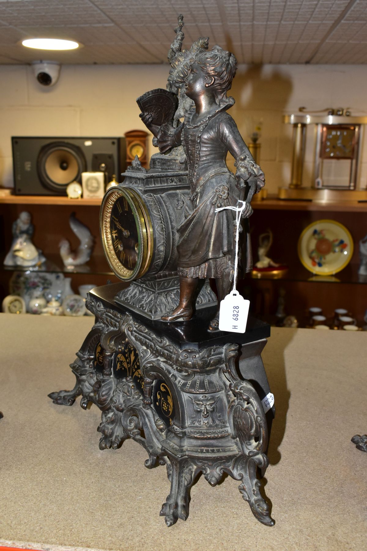 A LATE 19TH CENTURY BRONZED SPELTER AND BLACK SLATE CLOCK GARNITURE, the mantel clock with figure of - Image 10 of 14