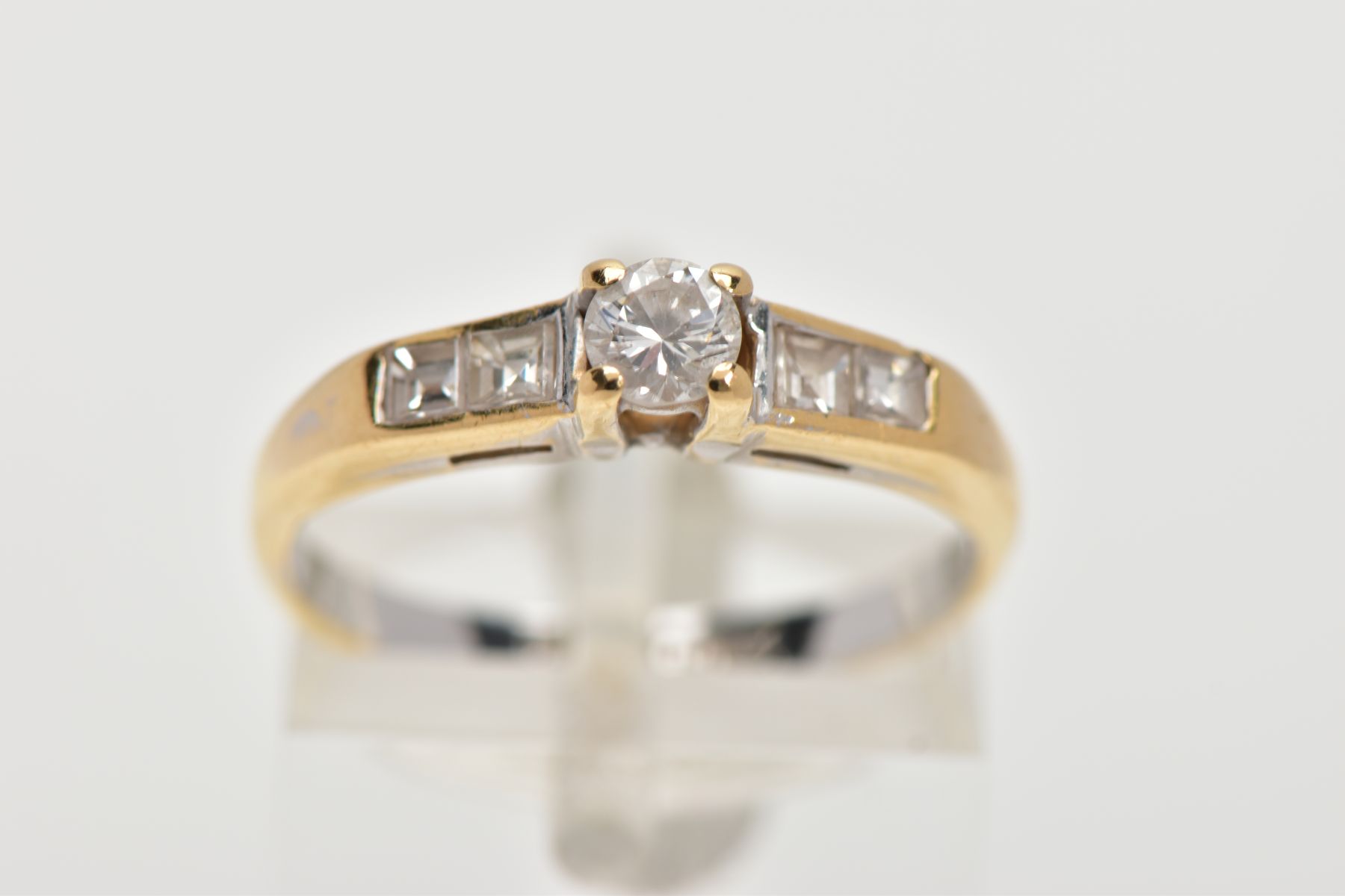 A DIAMOND RING, designed with a central brilliant cut diamond in a four claw setting, flanked by two - Image 5 of 6