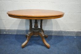 AN LATE VICTORIAN WALNUT AND MARQUETRY INLAID OVAL TILT TOP LOO TABLE supported by four spindles