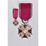 A PAIR OF ENAMELED POLISH ORDER OF MERIT MEDALS, two medals with enamel detailing and the letters