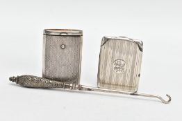 TWO SILVER VESTAS AND A SILVER HANDLED BUTTON HOOK, the first vesta of a rectangular form, engine