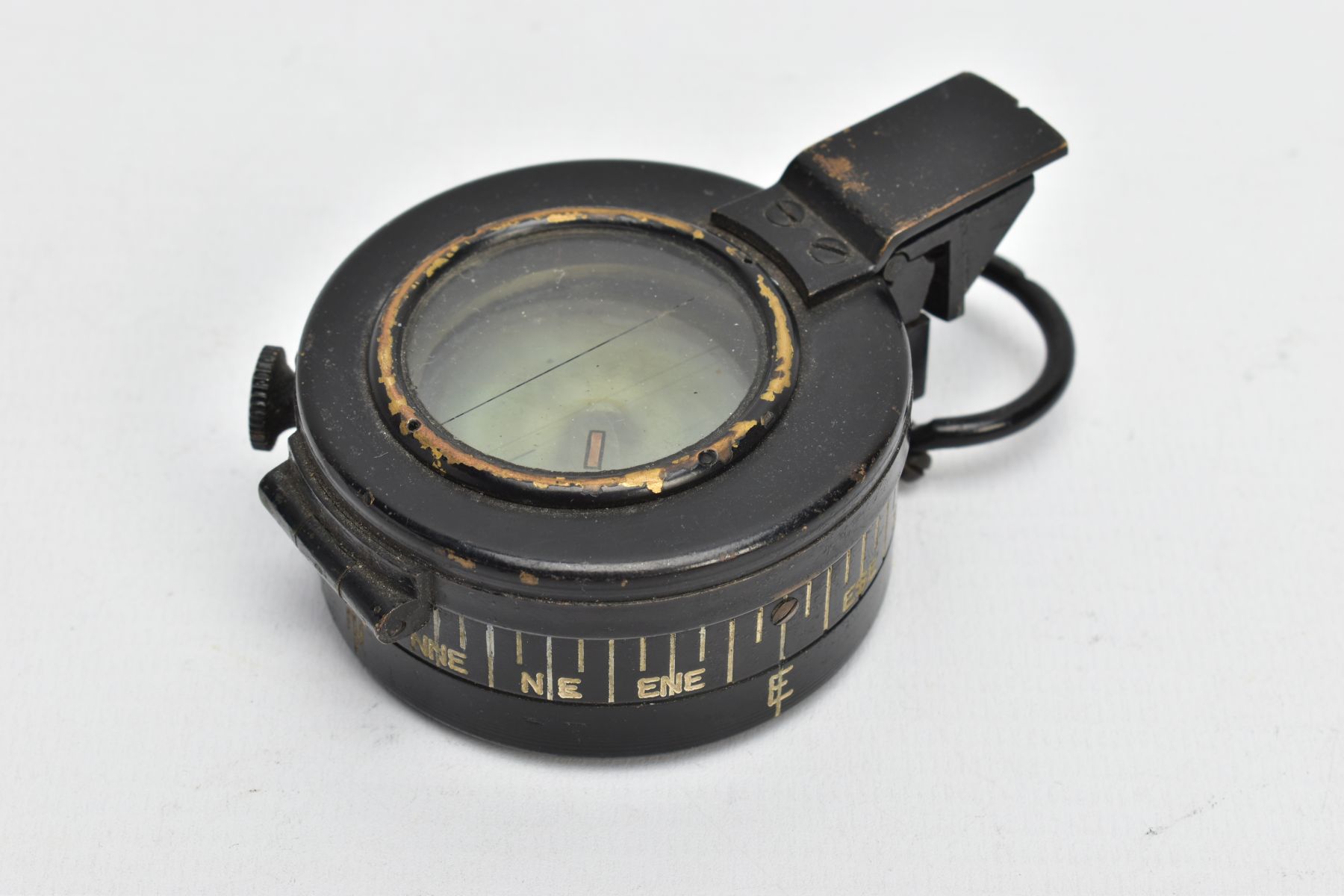 A MILITARY COMPASS, black compass, stamped T.G.C2 Ltd London number 234303, dated 1943 MK III