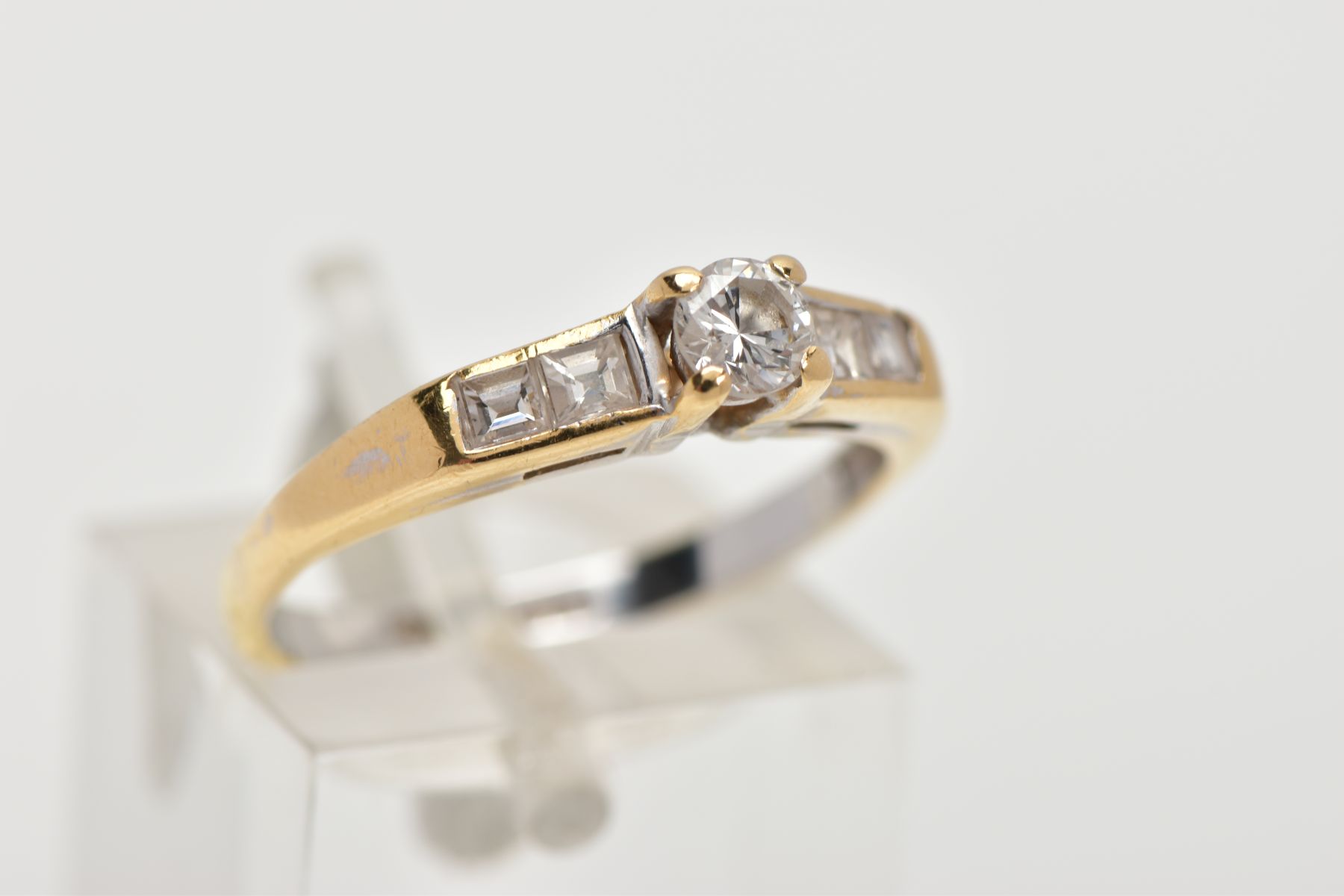 A DIAMOND RING, designed with a central brilliant cut diamond in a four claw setting, flanked by two - Image 4 of 6