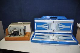 A VINTAGE DELSO DELUXE ELECTRIC SEWING MACHINE (bare cables so untested) and a plastic folding