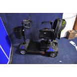 A DRIVE SCOUT MOBILITY SCOOTER with power supply and 2 keys (PAT pass and working)