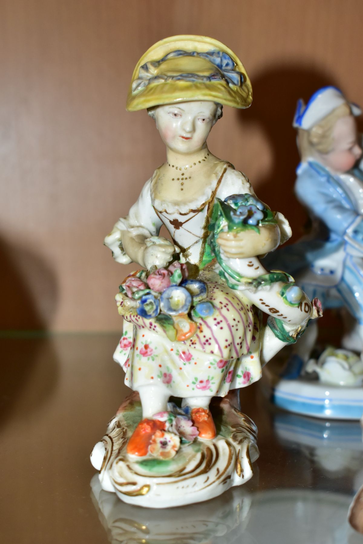 A GROUP OF FOUR 19TH AND 20TH CENTURY PORCELAIN FIGURES, comprising a figure of a putti with - Image 4 of 7