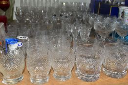 A QUANTITY OF CUT CRYSTAL DRINKING GLASSES, approximately eighty glasses, most are in sets, to