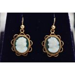 A PAIR OF 9CT GOLD CAMEO DROP EARRINGS, each set with a green and white oval cameo depicting a