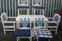 A CREAM PAINTED RECTANGULAR EXTENDING TEAK SLATTED GARDEN TABLE, closed width 133cm x open width