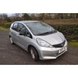 A HONDA JAZZ 1.4l VTECH five door hatchback in silver, petrol engine, first registered June 2013,