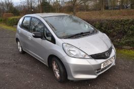 A HONDA JAZZ 1.4l VTECH five door hatchback in silver, petrol engine, first registered June 2013,