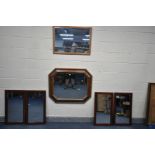 A RECTANGULAR WALNUT ART DECO STYLE WALL MIRROR with canted corners and bevel edge glass, 102cm x
