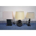 THREE VARIOUS BLACK FINISH TABLE LAMPS, of various styles and materials