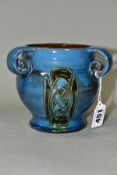 A C H BRANNAM BARUM POTTERY THREE HANDLED VASE, produced for Liberty & Co, tube lined decoration