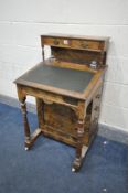 A LATE VICTORIAN BURR WALNUT DAVENPORT, the overhanging top with two drawer, above a leatherette