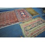 A SELECTION OF VARIOUS RUGS, to include a Moroccan flat weave rug, 190cm x 105cm, two tekke rugs,