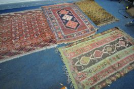 A SELECTION OF VARIOUS RUGS, to include a Moroccan flat weave rug, 190cm x 105cm, two tekke rugs,