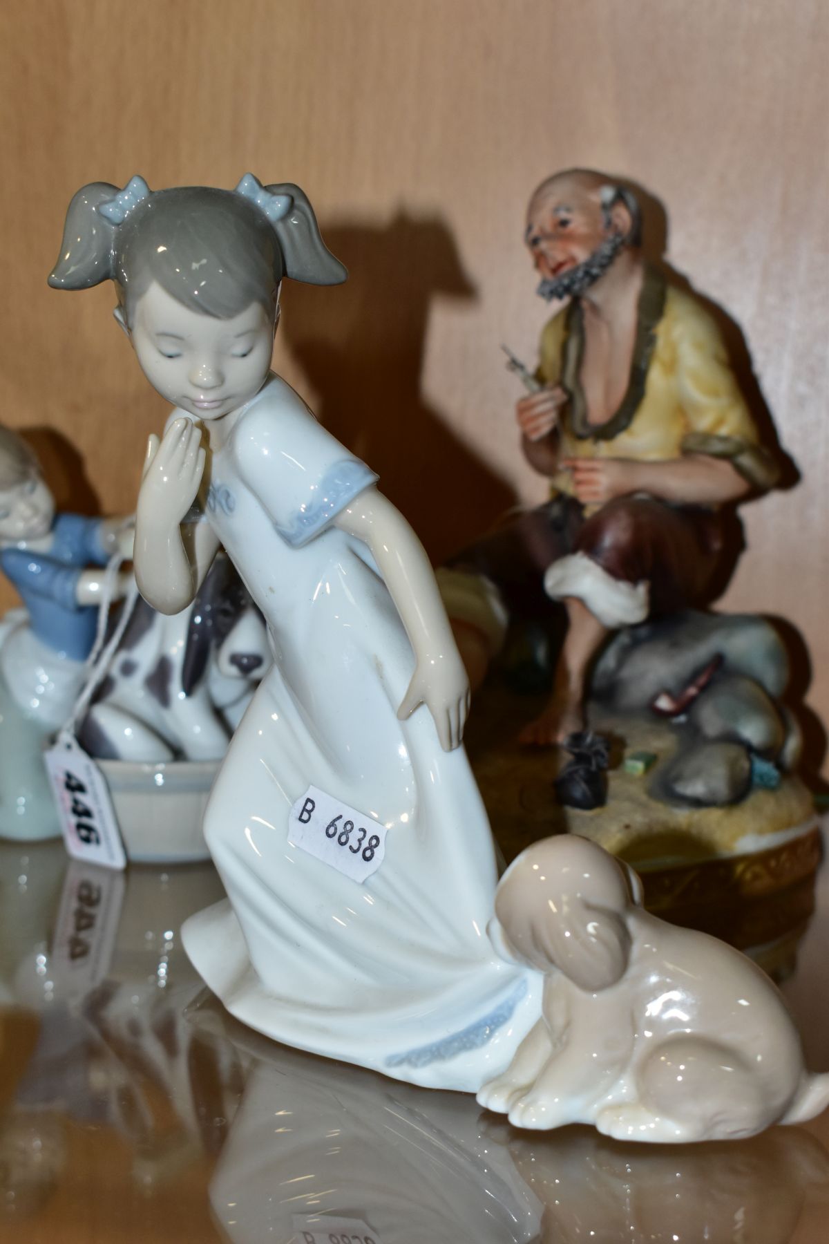 A LLADRO FIGURE AND TWO OTHER FIGURINES BY NAO AND LLADRO, the Lladro figure 'Bashful Bather' - Image 2 of 5